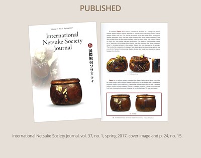 Lot 394 - TANAKA MINKO: AN INLAID WOOD TONKOTSU WITH A RAOYA CLEANING A SMOKING PIPE (KISERU)