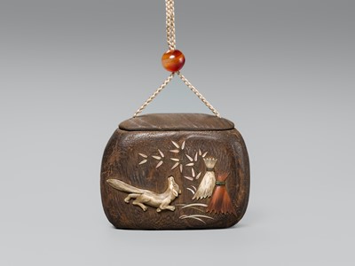 Lot 66 - A FINE INLAID KIRI WOOD TONKOTSU (TOBACCO CONTAINER) DEPICTING A KITSUNE (FOX)