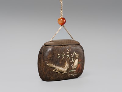 Lot 66 - A FINE INLAID KIRI WOOD TONKOTSU (TOBACCO CONTAINER) DEPICTING A KITSUNE (FOX)