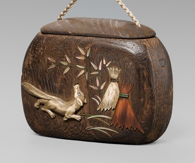 Lot 66 - A FINE INLAID KIRI WOOD TONKOTSU (TOBACCO CONTAINER) DEPICTING A KITSUNE (FOX)