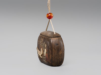 Lot 66 - A FINE INLAID KIRI WOOD TONKOTSU (TOBACCO CONTAINER) DEPICTING A KITSUNE (FOX)