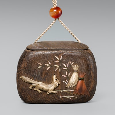 Lot 66 - A FINE INLAID KIRI WOOD TONKOTSU (TOBACCO CONTAINER) DEPICTING A KITSUNE (FOX)