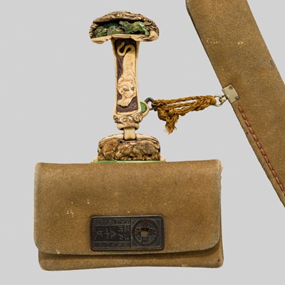 Lot 70 - HASEGAWA IKKO: A FINE LEATHER TABAKO-IRE (POUCH) WITH FINE ANTLER FITTINGS