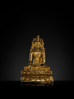 A TURQUOISE-INLAID GILT COPPER-ALLOY FIGURE OF THE CROWNED BUDDHA, TIBET, CIRCA 15TH-16TH CENTURY