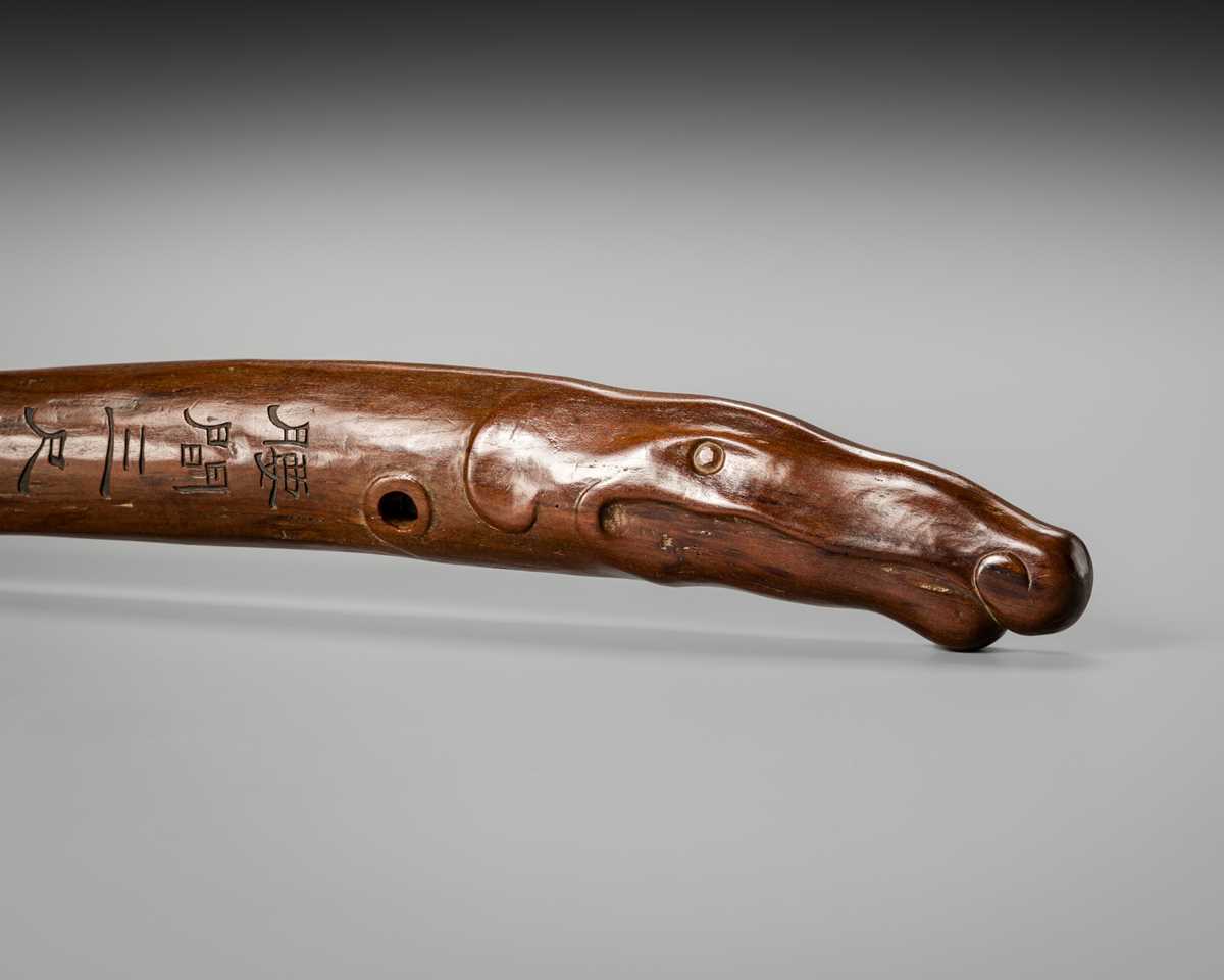 Lot 49 - AN INSCRIBED WOOD BOKUTO (DOCTOR’S SWORD) OF A SHACHIHOKO (DRAGONFISH)