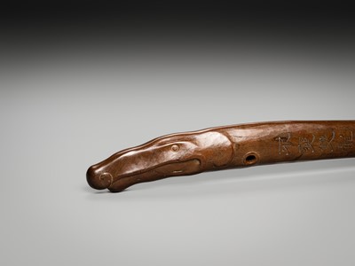 Lot 49 - AN INSCRIBED WOOD BOKUTO (DOCTOR’S SWORD) OF A SHACHIHOKO (DRAGONFISH)