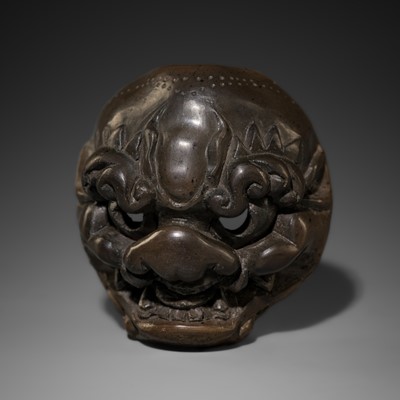 YOSHISHIGE: AN UNUSUAL BUFFALO HORN MASK NETSUKE OF A SHISHI