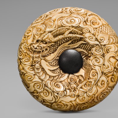 Lot 68 - HASEGAWA IKKO: A LARGE AND SUPERB IVORY MANJU NETSUKE OF A DRAGON