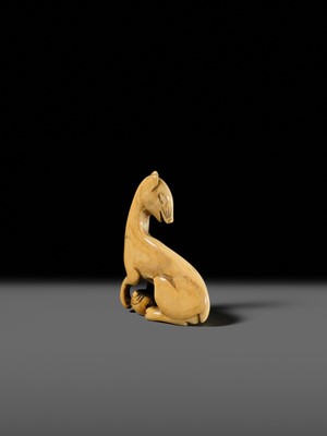 Lot 97 - A SUPERB AND RARE IVORY NETSUKE OF AN INARI FOX WITH TWO TAMA (SACRED JEWELS)