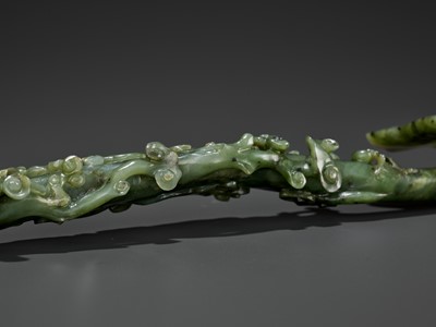 Lot 70 - A SPINACH-GREEN JADE RUYI SCEPTER, MID-QING