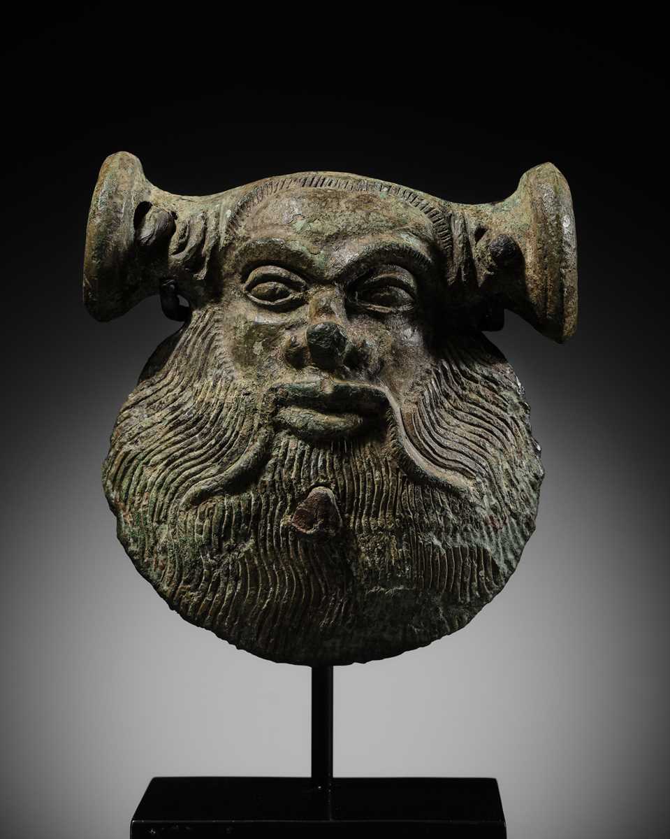 Lot 78 - A GREEK BRONZE MASK OF SILENUS, CIRCA EARLY 5TH CENTURY BC
