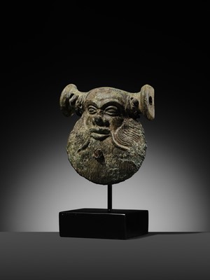 Lot 78 - A GREEK BRONZE MASK OF SILENUS, CIRCA EARLY 5TH CENTURY BC