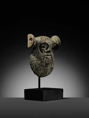 Lot 78 - A GREEK BRONZE MASK OF SILENUS, CIRCA EARLY 5TH CENTURY BC