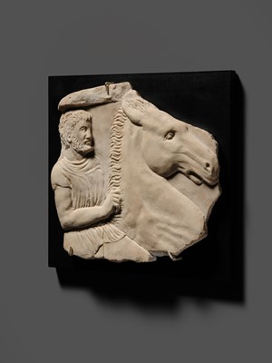 Lot 65 - A ROMAN WHITE MARBLE RELIEF FRAGMENT OF A SARCOPHAGUS DEPICTING A HORSEMAN AND STEED, CIRCA 2ND CENTURY AD