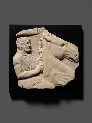 Lot 65 - A ROMAN WHITE MARBLE RELIEF FRAGMENT OF A SARCOPHAGUS DEPICTING A HORSEMAN AND STEED, CIRCA 2ND CENTURY AD