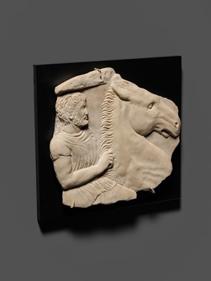 Lot 65 - A ROMAN WHITE MARBLE RELIEF FRAGMENT OF A SARCOPHAGUS DEPICTING A HORSEMAN AND STEED, CIRCA 2ND CENTURY AD