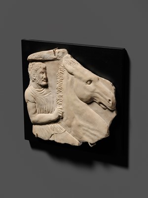 Lot 65 - A ROMAN WHITE MARBLE RELIEF FRAGMENT OF A SARCOPHAGUS DEPICTING A HORSEMAN AND STEED, CIRCA 2ND CENTURY AD