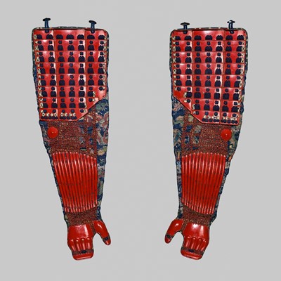 Lot 120 - A PAIR OF RED-LACQUERED IRON KOSHINOKOTE (SLEEVES)