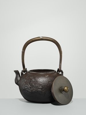 Lot 43 - RYUBUNDO: AN IRON TEA KETTLE (TETSUBIN) WITH A NOCTURNAL LANDSCAPE UNDER THE CRESCENT MOON