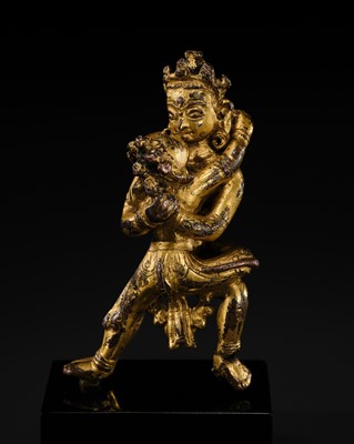Lot 31 - A MINIATURE GILT BRONZE FIGURE OF CHAKRASAMVARA AND VAJRAVAHARI, 14TH CENTURY