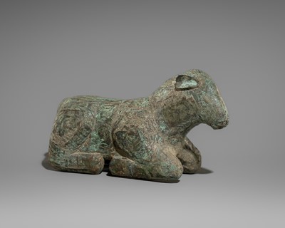 Lot 1509 - A BRONZE FIGURE OF A RECUMBENT LAMB, DONG SON CULTURE