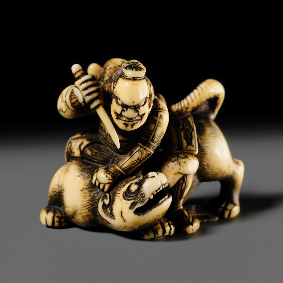 Lot 137 - SADATSUGU: A SUPERB IVORY NETSUKE OF INO HAYATA SLAYING THE NUE