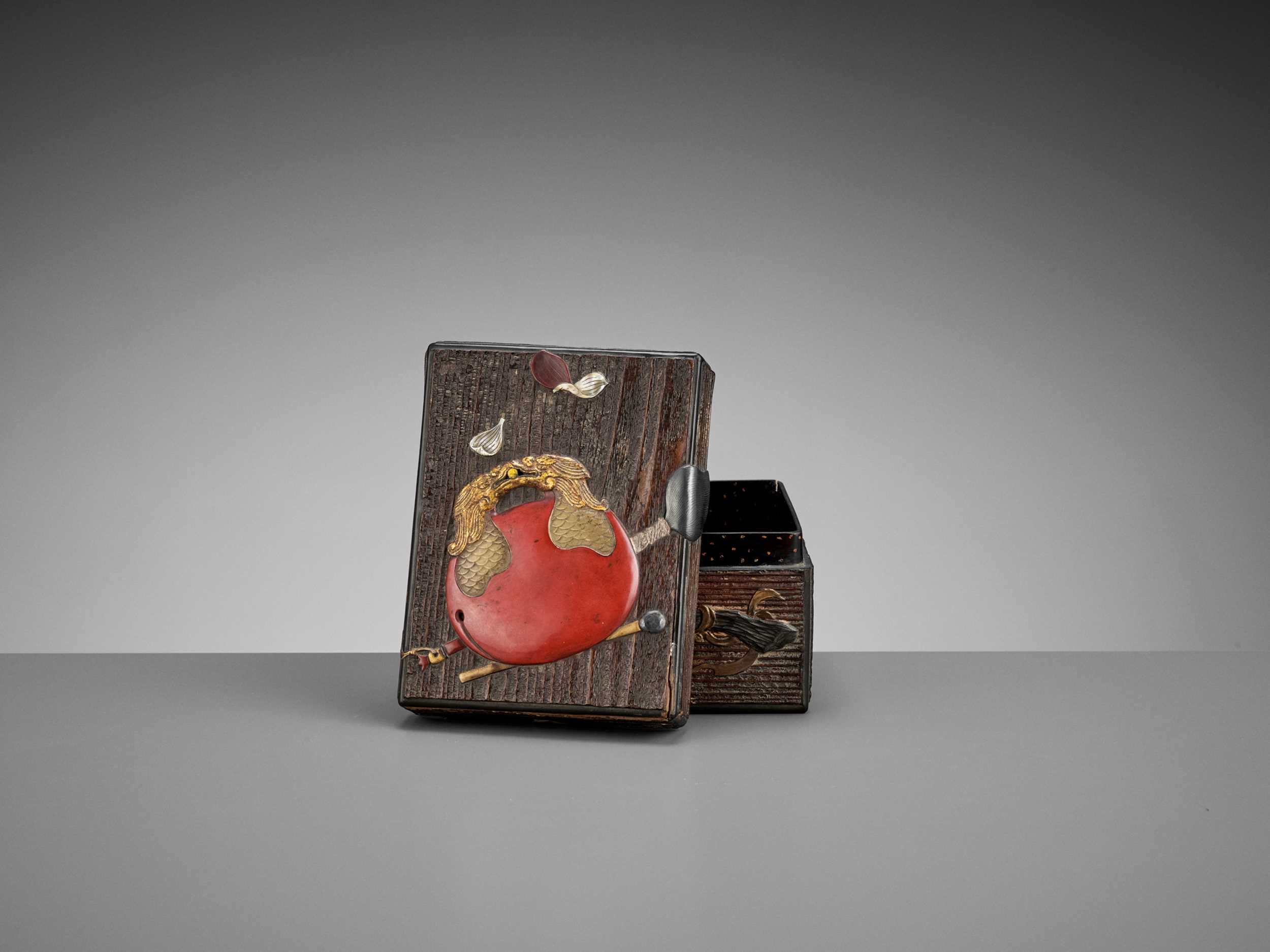 Lot 95 - OGAWA HARITSU (RITSUO): A SMALL CERAMIC AND LACQUER INLAID KIRI WOOD BOX AND COVER WITH BUDDHIST OBJECTS