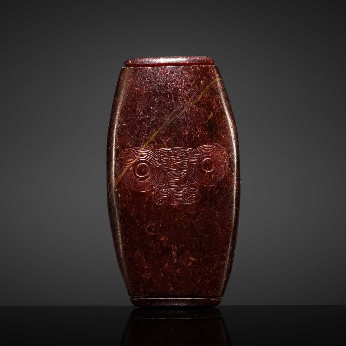 A RARE AND LARGE NEOLITHIC SERPENTINE ‘MASK’ BEAD, LIANGZHU CULTURE