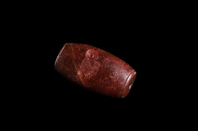 A RARE AND LARGE NEOLITHIC SERPENTINE ‘MASK’ BEAD, LIANGZHU CULTURE