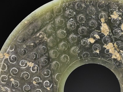 Lot 75 - A CELADON AND GREEN JADE BI DISC, WARRING STATES TO HAN DYNASTY