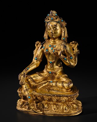 Lot 79 - A TURQUOISE-INLAID GILT-COPPER REPOUSSÉ FIGURE OF GREEN TARA, TIBETAN-CHINESE, 17TH - 18TH CENTURY