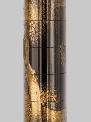 Lot 385 - KAJIKAWA: A SUPERB FOUR-CASE INLAID GOLD-LACQUER INRO SET WITH MINAMOTO NO YOSHITSUNE BESIDE A CHERRY TREE