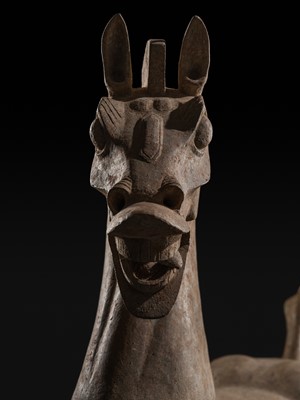 Lot 140 - A MONUMENTAL AND HIGHLY IMPORTANT SICHUAN POTTERY HORSE, HAN DYNASTY, THE LARGEST EVER RECORDED FROM THIS GROUP