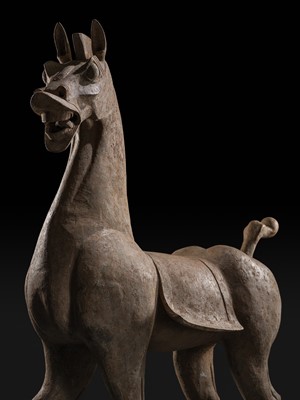 Lot 140 - A MONUMENTAL AND HIGHLY IMPORTANT SICHUAN POTTERY HORSE, HAN DYNASTY, THE LARGEST EVER RECORDED FROM THIS GROUP
