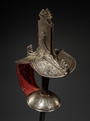 Lot 379 - A MUGHAL SILVER AND IRON FIRANGI SWORD HILT, 18TH – 19TH CENTURY