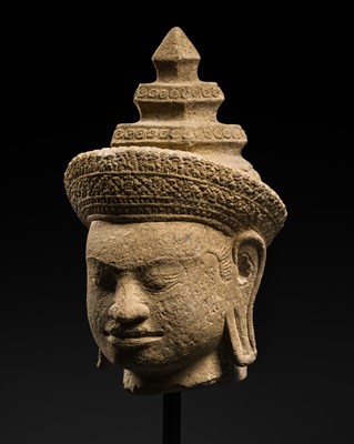 Lot 399 - A SANDSTONE HEAD OF VISHNU, ANGKOR PERIOD, PRE RUP STYLE