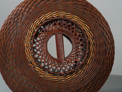 Lot 1557 - OKAZAKI CHIKUHOSAI II: A BAMBOO AND RATTAN HANAKAGO (FLOWER BASKET)