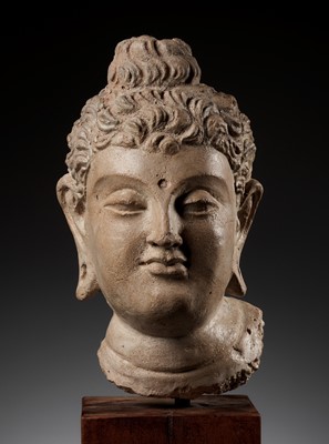 Lot 558 - A RARE AND IMPORTANT TERRACOTTA HEAD OF BUDDHA SHAKYAMUNI