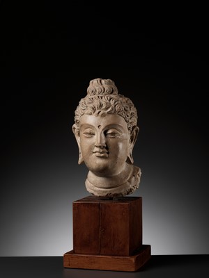 Lot 558 - A RARE AND IMPORTANT TERRACOTTA HEAD OF BUDDHA SHAKYAMUNI