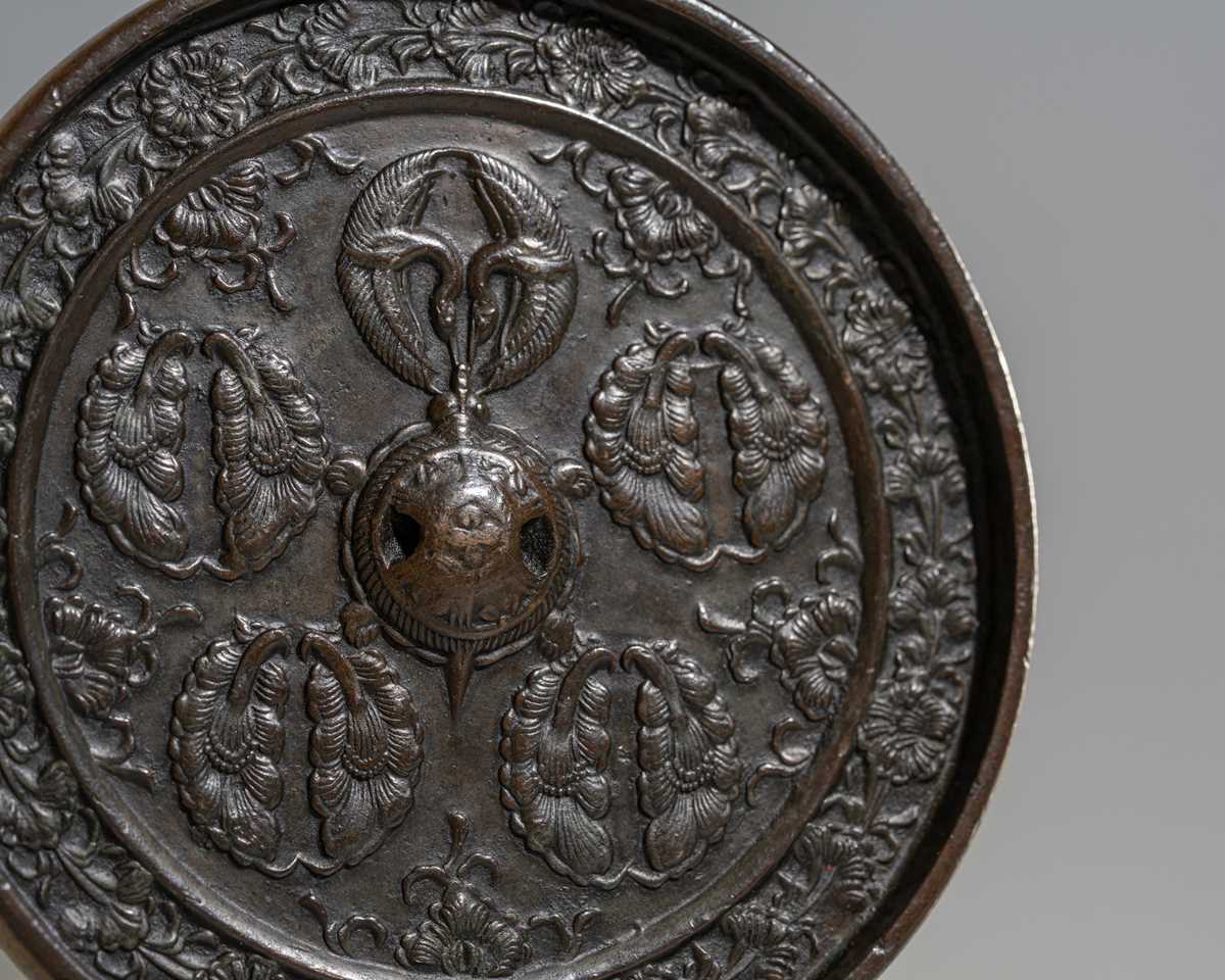 A BRONZE ‘GINGER CRESTS AND CRANES’ MIRROR