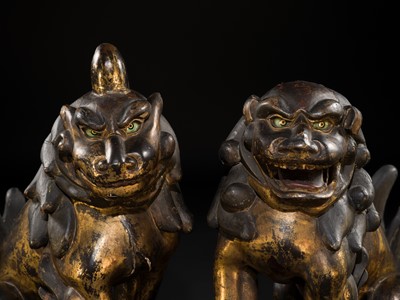 Lot 102 - AN IMPRESSIVE PAIR OF LARGE POLYCHROME AND GILT-LACQUERED WOOD KOMAINU (KOREAN GUARDIAN DOGS), KAMAKURA TO NANBOKUCHO PERIOD