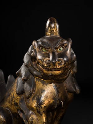 Lot 102 - AN IMPRESSIVE PAIR OF LARGE POLYCHROME AND GILT-LACQUERED WOOD KOMAINU (KOREAN GUARDIAN DOGS), KAMAKURA TO NANBOKUCHO PERIOD