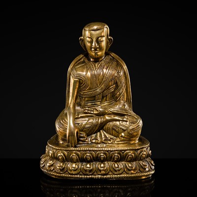 Lot 42 - A GILT-BRONZE FIGURE OF A LAMA, 18TH CENTURY