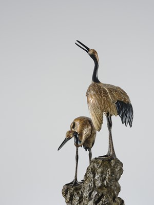 Lot 9 - MASAMITSU: AN IMPRESSIVE SILVER-PATINATED BRONZE OKIMONO OF TWO CRANES ON A ROCK