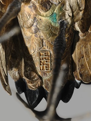 Lot 9 - MASAMITSU: AN IMPRESSIVE SILVER-PATINATED BRONZE OKIMONO OF TWO CRANES ON A ROCK