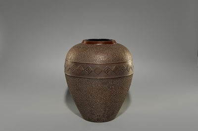 A LARGE IRON VASE WITH GEOMETRIC DECORATION