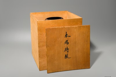 A LARGE IRON VASE WITH GEOMETRIC DECORATION