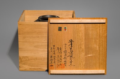 A LARGE IRON VASE WITH GEOMETRIC DECORATION