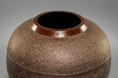 A LARGE IRON VASE WITH GEOMETRIC DECORATION
