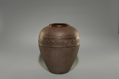 A LARGE IRON VASE WITH GEOMETRIC DECORATION